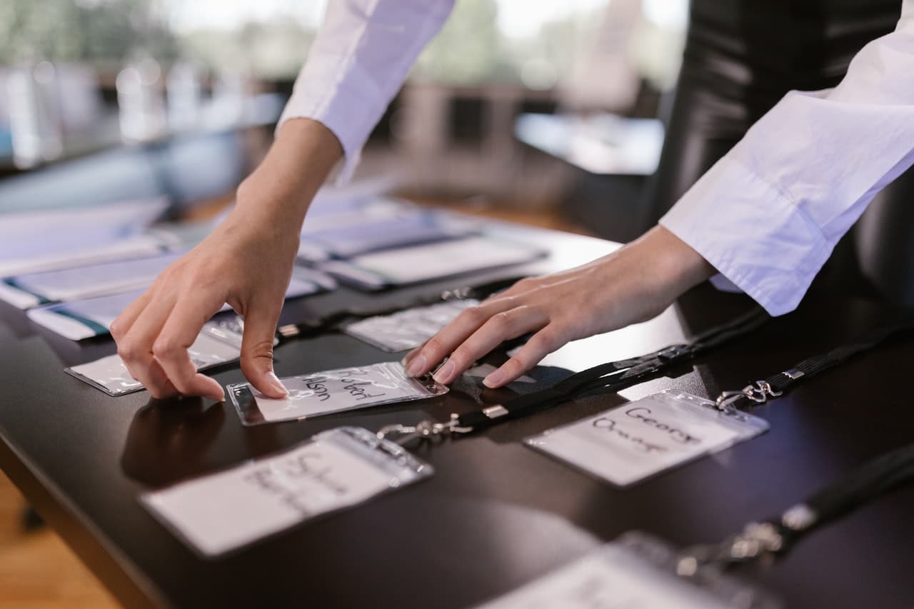 woman sorting out badges