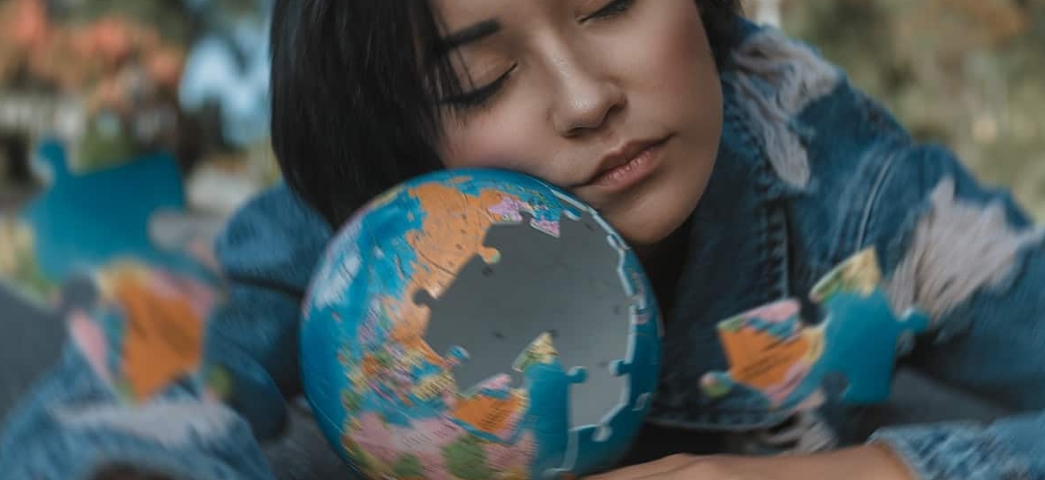 girl with a puzzle globe