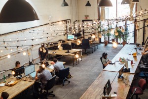 Employees working at their desk with lights on.