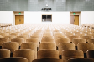 Empty classroom with wood chairs.