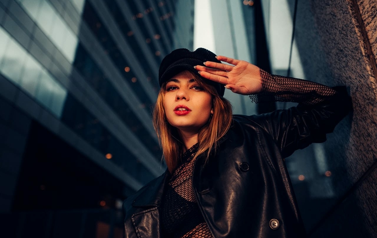 girl posing near a skyscraper