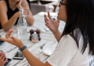 girl-speaking-table