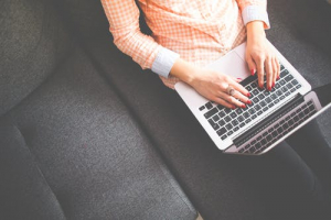 woman-on-a-couch-with-a-computer