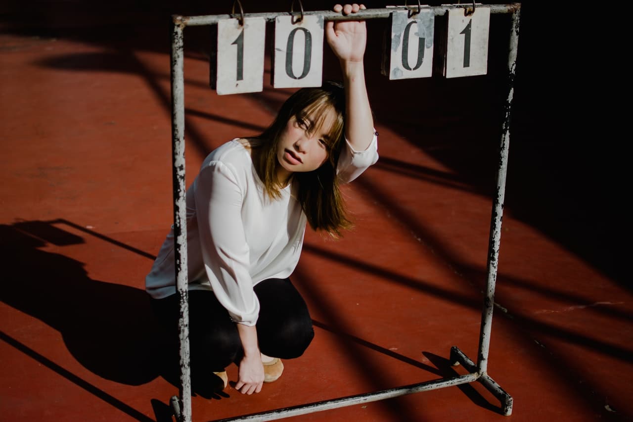 girl holding a game score panel