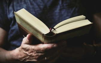 man holding a book