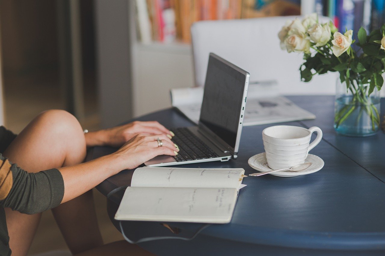 woman typing on her keyboard