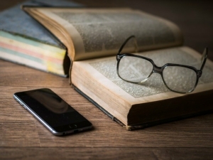 book-glasses-and-phone-on-a-table