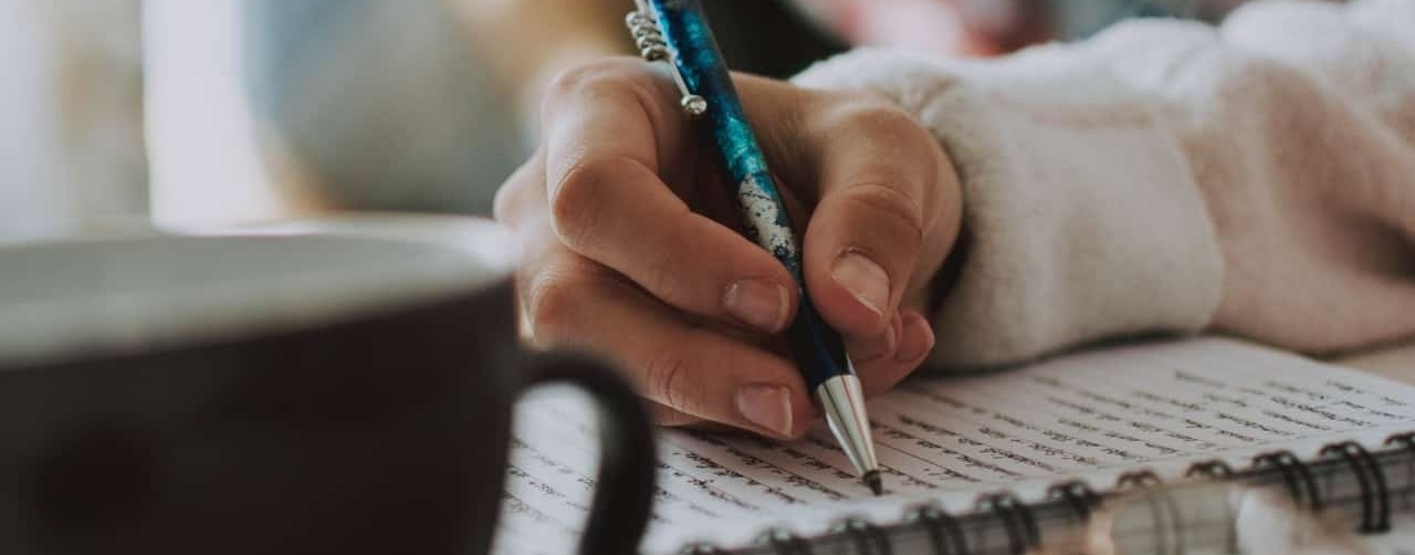 woman writing in a notebook