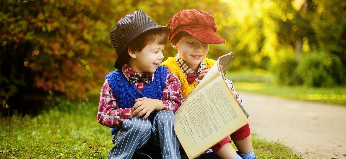 two-littel-boys-reading-a-book