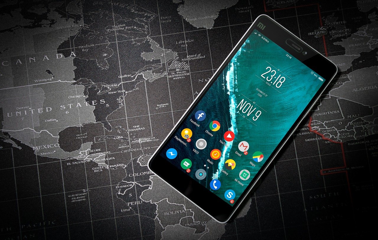 an android phone on a world map