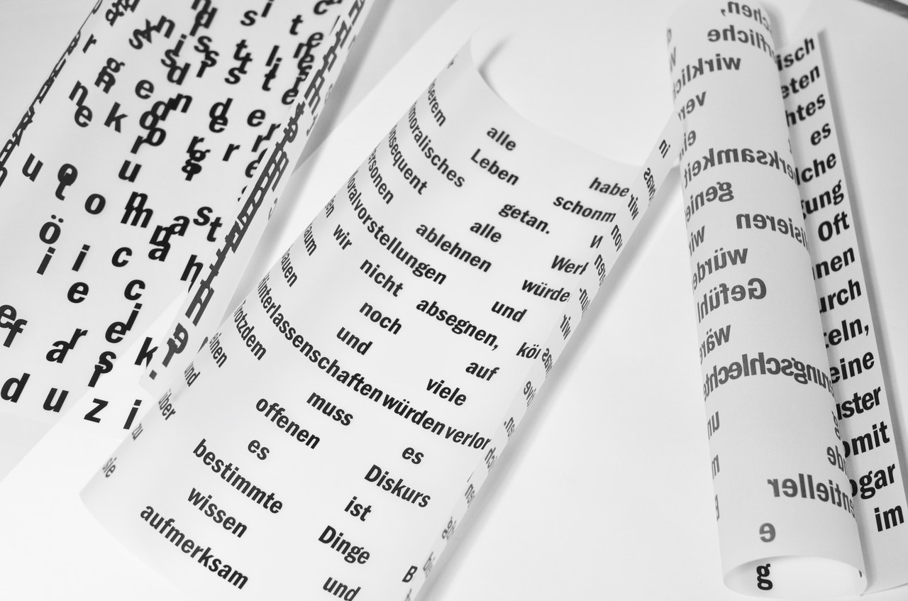 german words on three pieces of paper