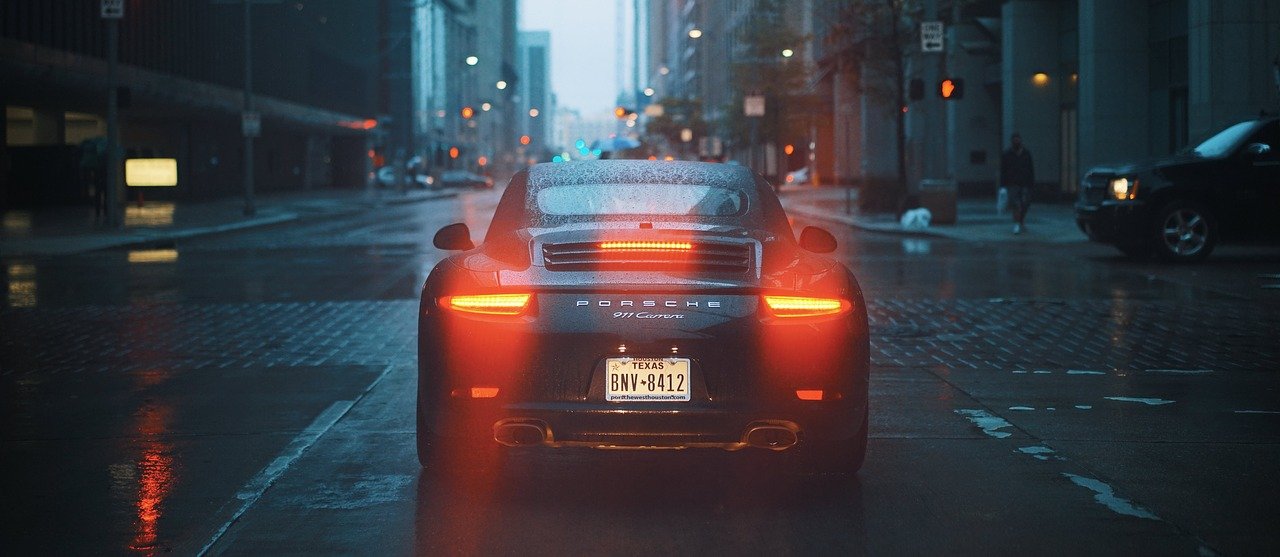 a porsche car in the street