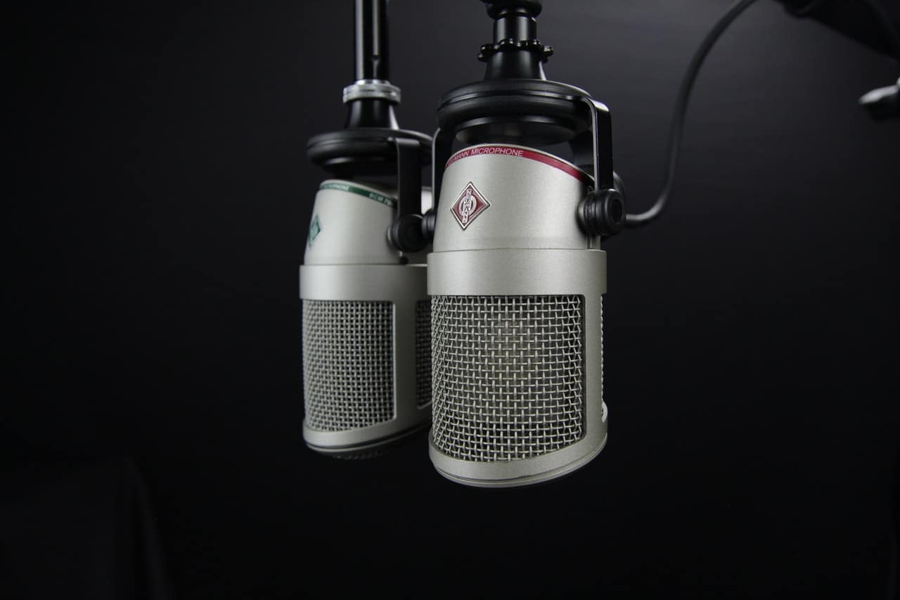 two microphones on a dark background