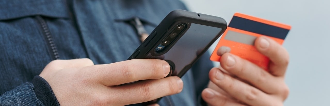 man making a payment with his credit card