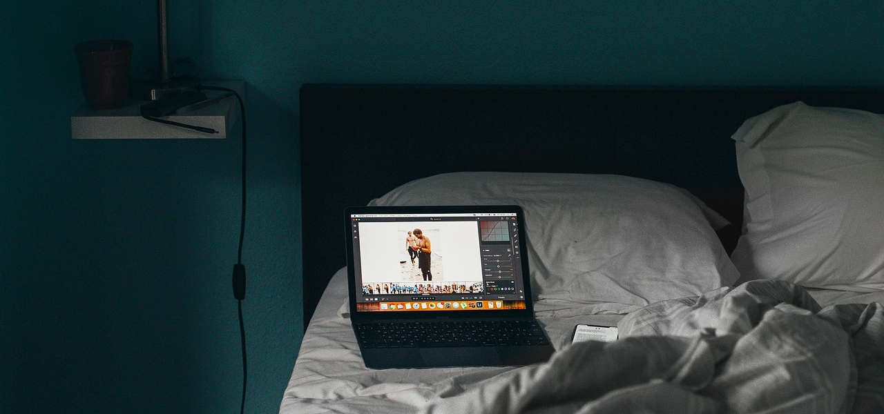 a computer on a bed