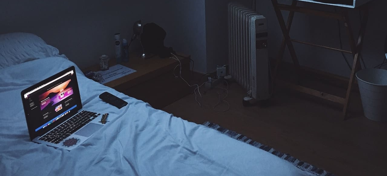 a computer on a bed