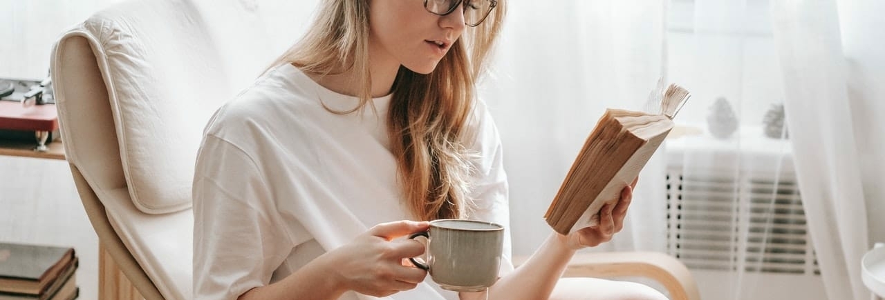 girl reading in a chair