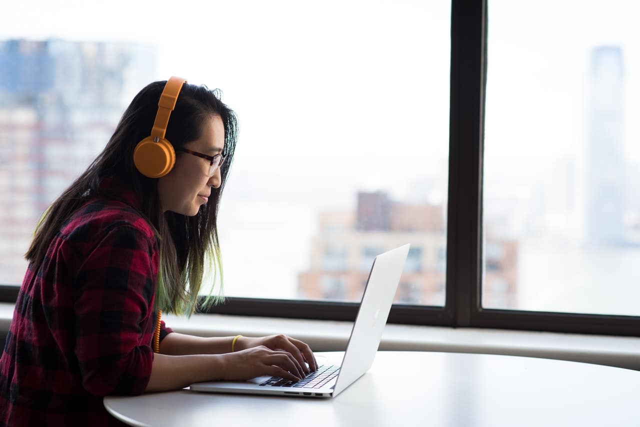 girl studying with headphones on